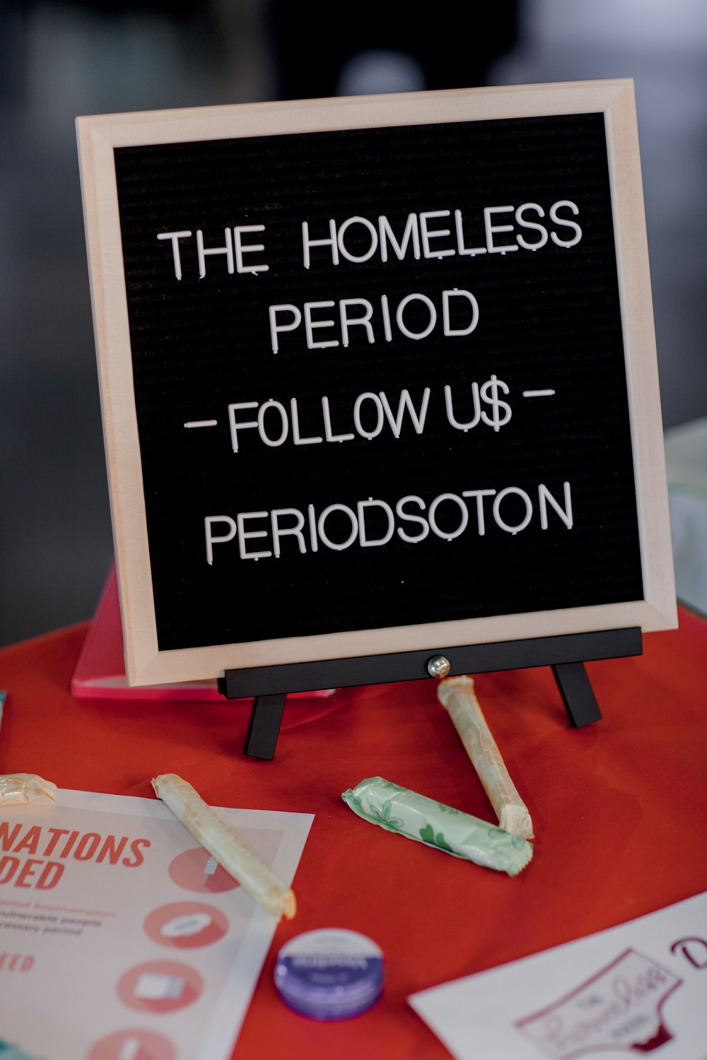 peg board that says 'The Homeless Period - Follow Us - PeriodSoton"